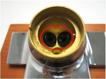 Once the ball valve is removed, look inside the faucet body and locate the seats and springs.