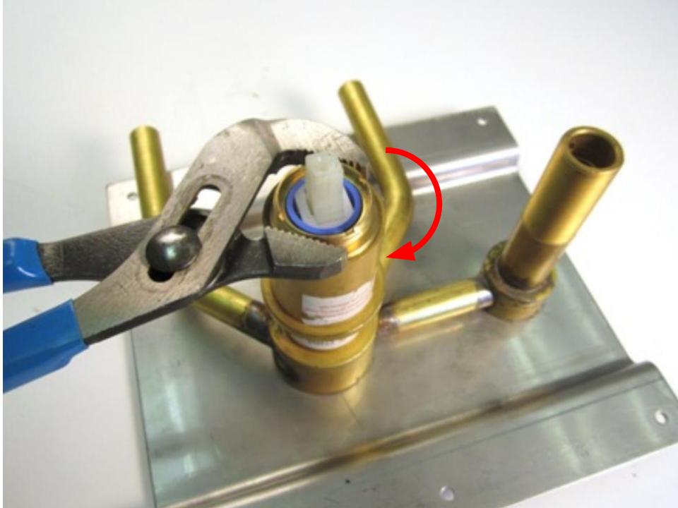 Re-install the locking nut with a pair of adjustable pliers. In order to avoid over tightening the locking nut, hand tighten the locking nut, and then use the adjustable pliers to apply a quarter turn. Overall 10-14 lbs of torque are required to properly install the locking nut. 