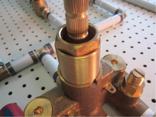 To remove the cartridge, use the sleeve removal tool. To do so, slide the sleeve removal tool onto the cartridge assembly