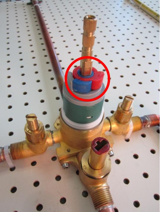 The temperature limiting device is installed on tub/shower faucets and is an important safety feature that prevents injuries caused by scalding hot water. If the temperature limiting device for your faucet has become damaged, or is missing, the temperature limiting device may need to be replaced.